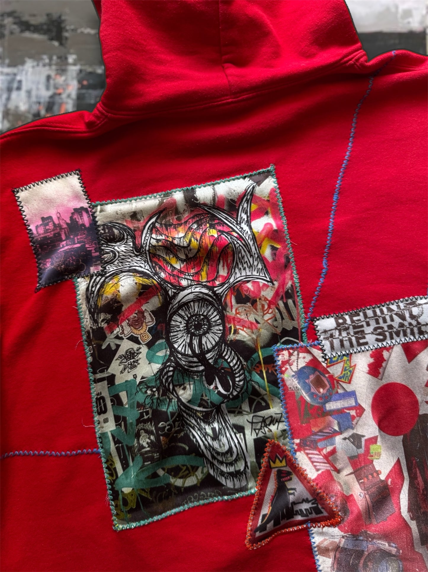 “George” red hoodie with stitched art