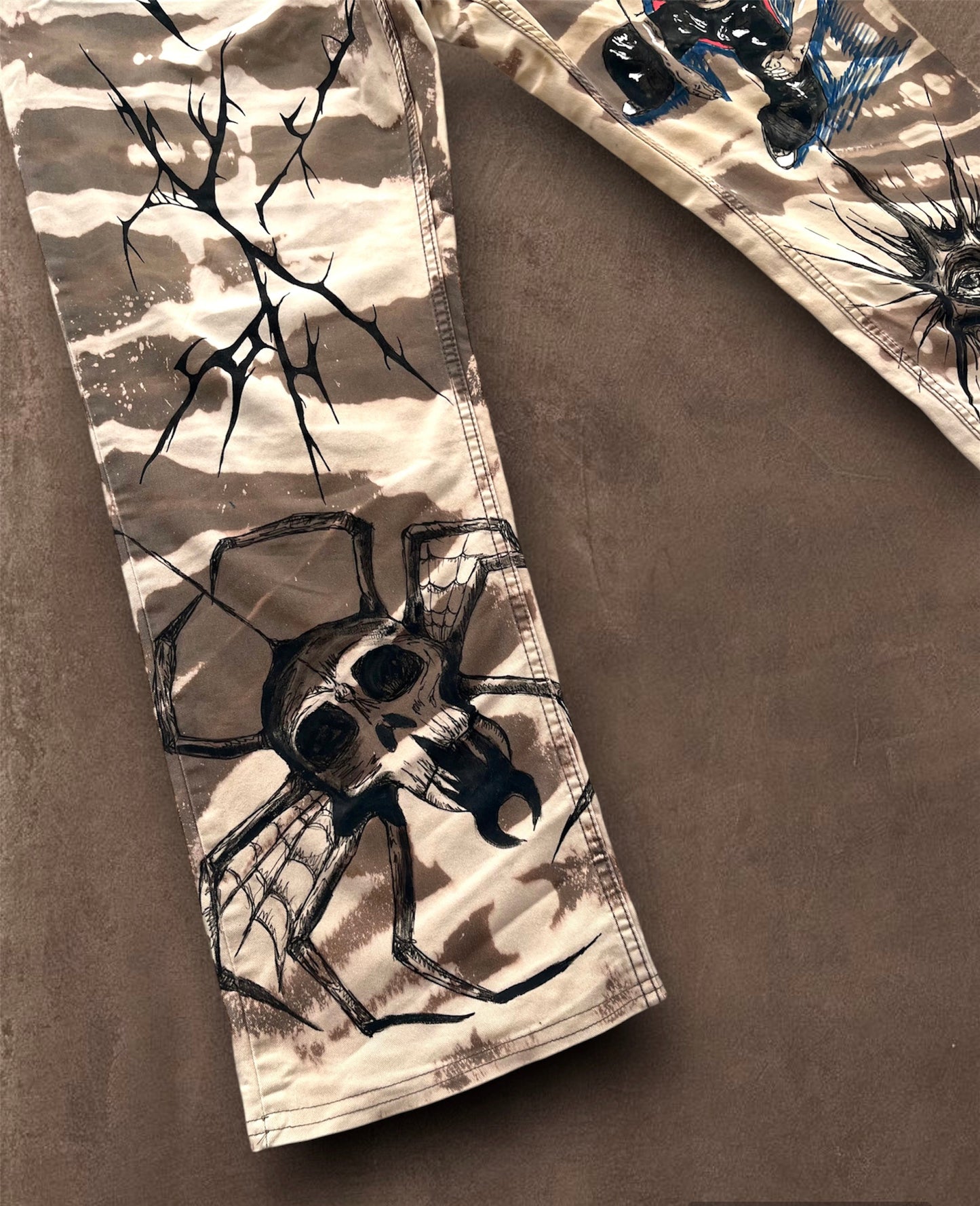 “Skull punk” bleached hand painted trousers
