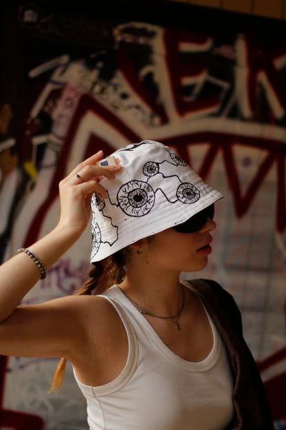 Double-sided/reversible bucked hat with hand painted/bleached elements
