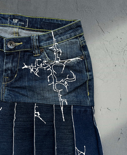Pleated denim skirt with 3D art