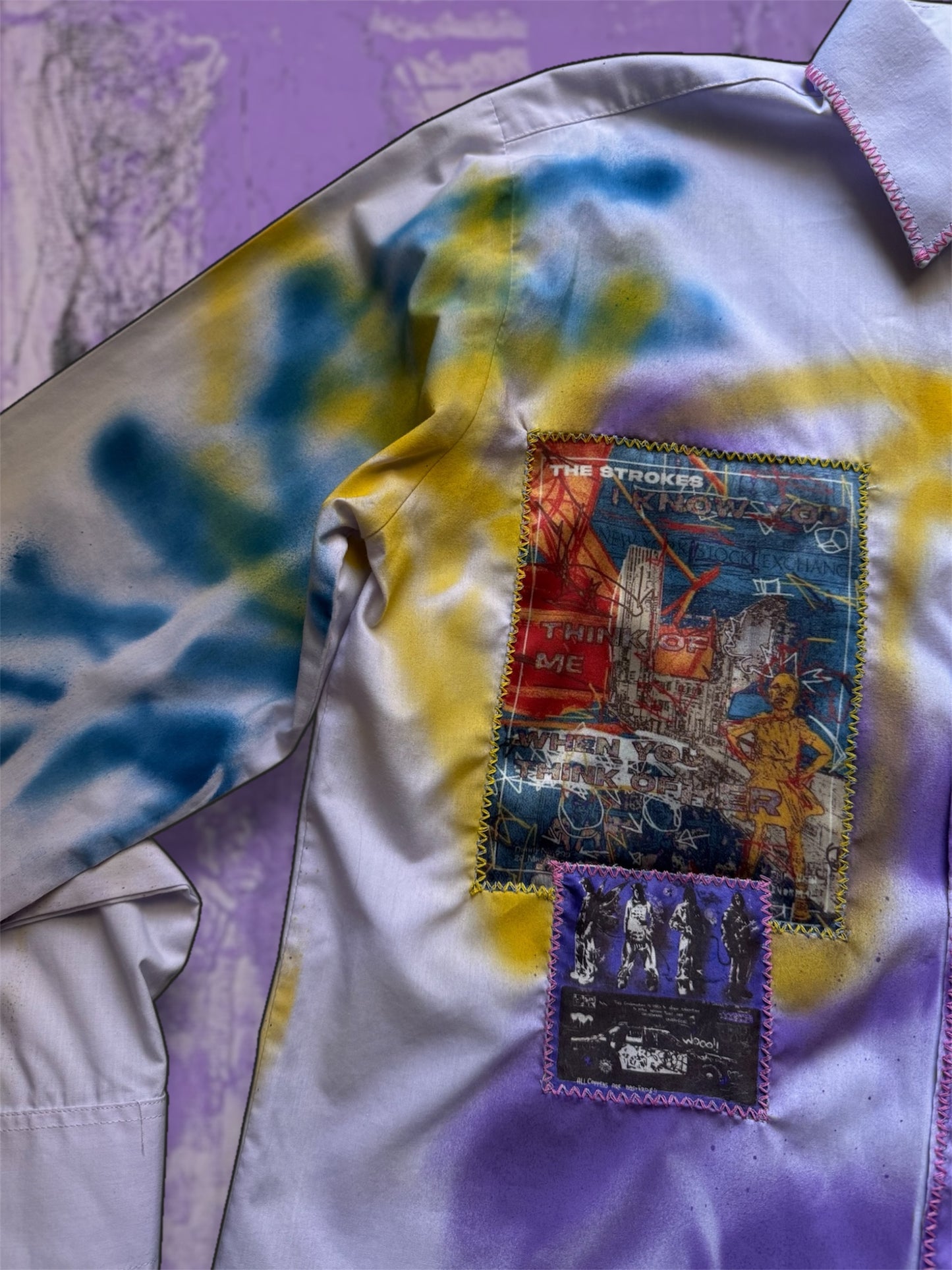 Sprayed light purple shirt with art pictures