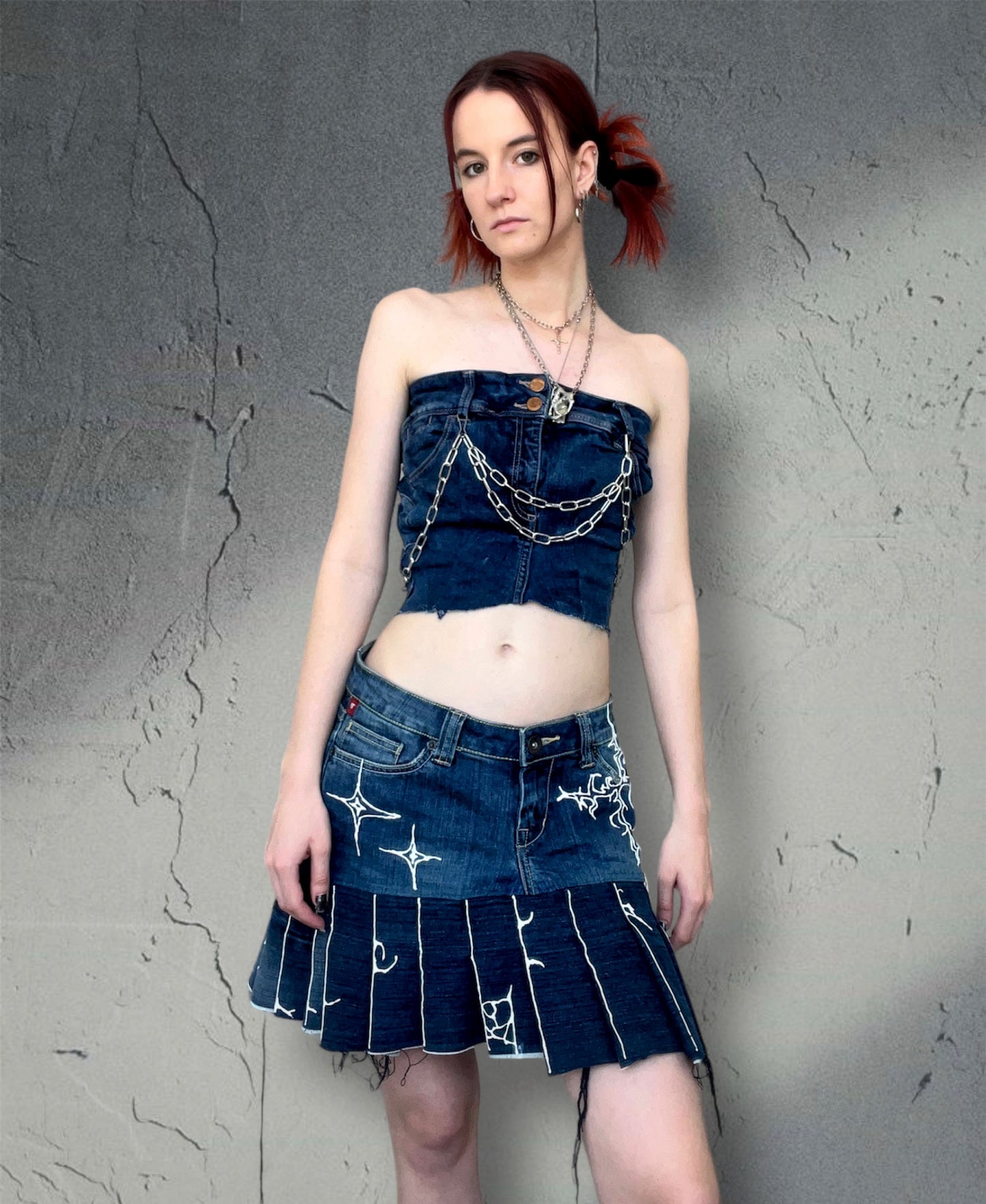 Pleated denim skirt with 3D art