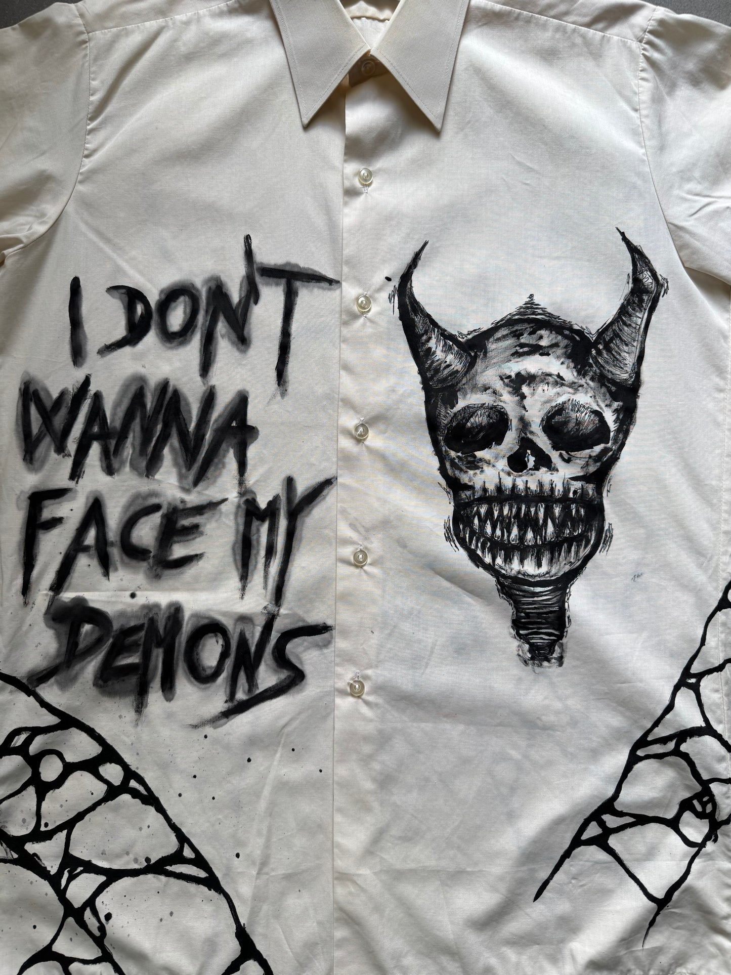 “FACING DEMONS” painted shirt