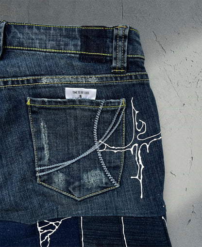 Pleated denim skirt with 3D art