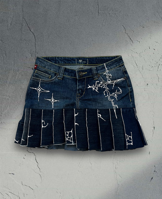 Pleated denim skirt with 3D art
