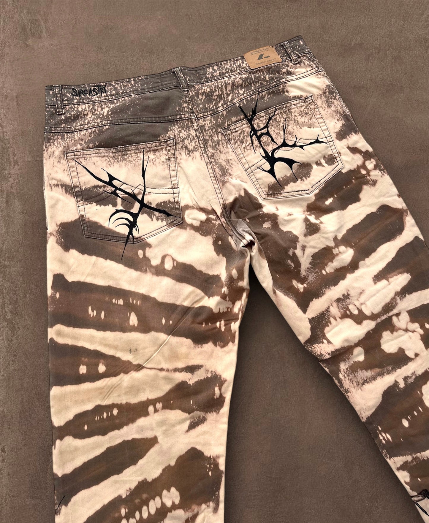 “Skull punk” bleached hand painted trousers