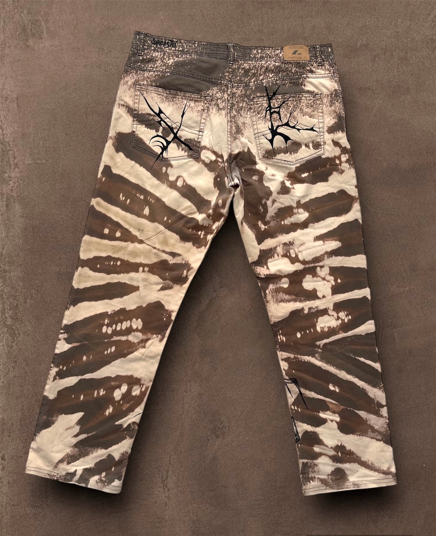 “Skull punk” bleached hand painted trousers