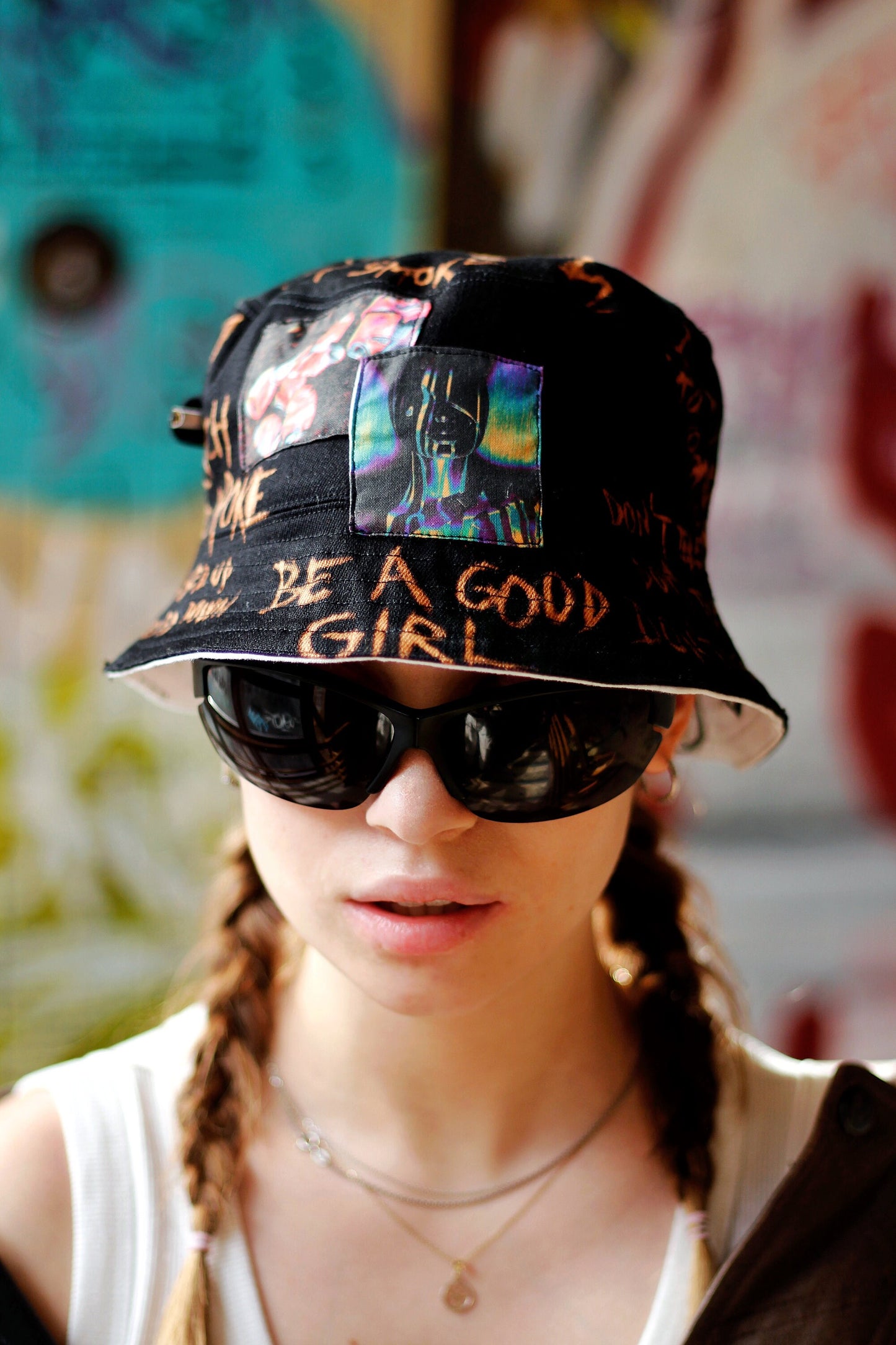 Double-sided/reversible bucked hat with hand painted/bleached elements
