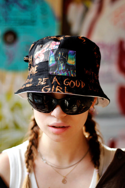 Double-sided/reversible bucked hat with hand painted/bleached elements