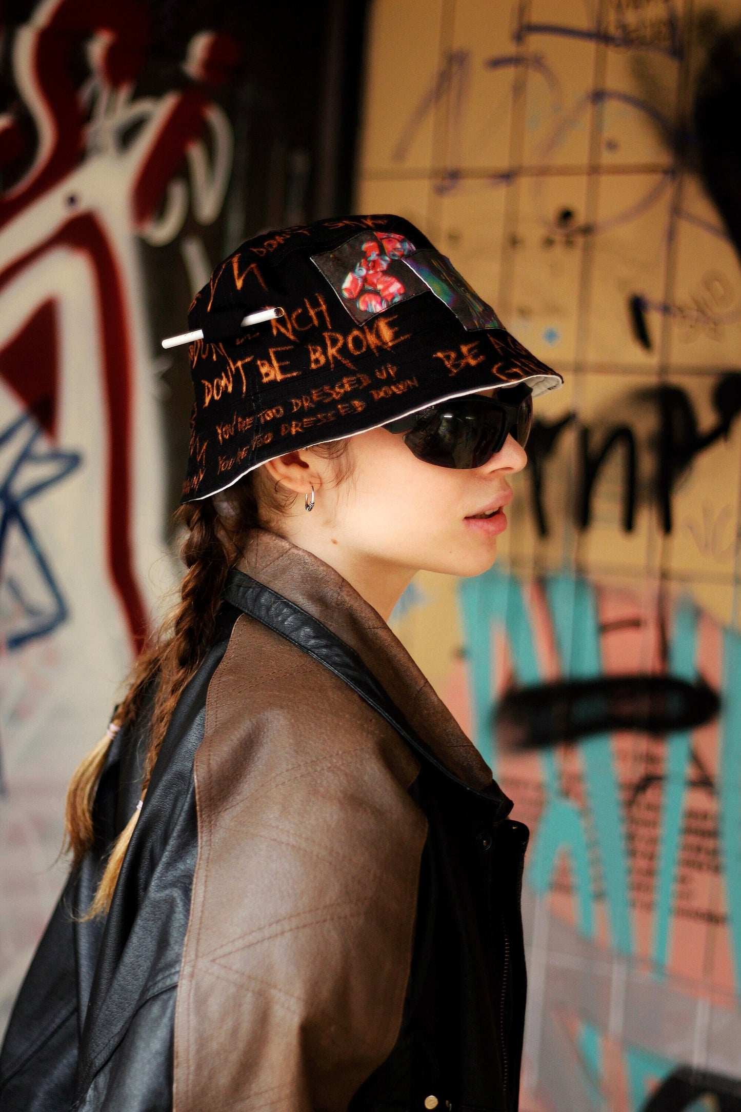 Double-sided/reversible bucked hat with hand painted/bleached elements