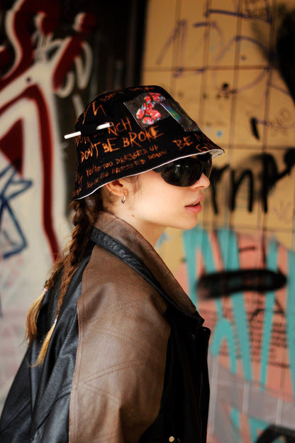 Double-sided/reversible bucked hat with hand painted/bleached elements
