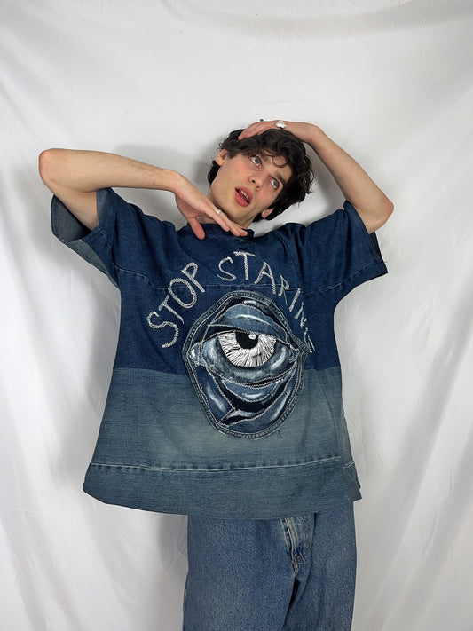 Baggy blue denim T-shirt with textured “Stop staring” title